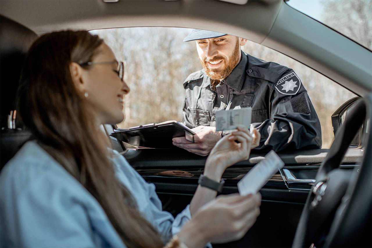 Policeman checking documents of driver IDP
